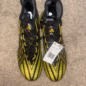 Adidas Black Gold and Yellow cleats
